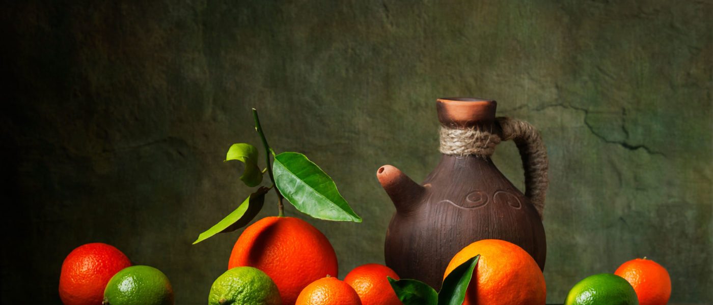 Still life with citrus fruit and jug